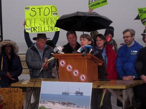 FILE - In this Wednesday, Feb. 7, 2018 file photo, Cindy Zipf, executive director of the Clean Ocean Action environmental group, speaks at a rally in Asbury Park, N.J., against President Trump's plan to allow oil and natural gas drilling off most of the nation's coastline. Opponents of Trump's plan to open most of the nation's coastline to oil and natural gas drilling have held boisterous rallies before public meetings held by the federal government on the topic.