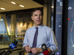 Minister of Finance Bill Morneau speaks to media after meeting with private sector economists, in Toronto on Friday, February 16, 2018.