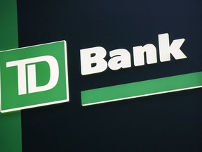 FILE - In this Nov. 12, 2010 file photo, a sign for TD Bank is shown in New York.