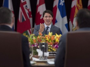 Prime Minister Justin Trudeau says he is talking to premiers regularly about the need to get a western pipeline expansion built but stopped short of agreeing to intervene in an emerging trade war between British Columbia and Alberta. Prime Minister Justin Trudeau gestures to Indigenous leaders and Premiers as he delivers his opening remarks at the First Ministers Meeting in Ottawa, Tuesday, October 3, 2017.
