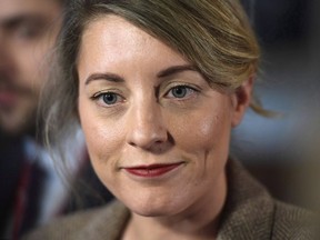 Minister of Canadian Heritage Melanie Joly speaks to reporters after leaving a cabinet meeting on Parliament Hill in Ottawa on Tuesday, Feb. 6, 2018. A warning from Canada???s biggest media companies that their survival is under threat from unregulated foreign rivals and illicit content pirates has sparked a massive influx of submissions to the federal telecommunications regulator from consumers with little sympathy for their cause.THE CANADIAN PRESS/Justin Tang