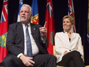 Ontario Premier Kathleen Wynne (right) and Quebec Premier Philippe Couillard attend the Confederation of Tomorrow 2.0 Conference in Toronto on Tuesday December 12, 2017. The premiers of Canada's two largest provinces are in Washington pleading for a modernized NAFTA that brings to an end the trade uncertainty that currently exists on the continent.THE CANADIAN PRESS/Chris Young