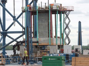 A cement footing is set to be placed in the river at the site of the new Champlain Bridge Friday, July 8, 2016 in Montreal. he consortium building the new Champlain Bridge in Montreal says it is aiming to have the structure ready as planned by the end of 2018.