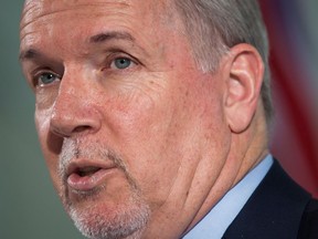 Premier John Horgan says he plans to intensify efforts to find new markets for B.C. wine, which was already being done before Alberta's ban over the Trans Mountain pipeline. British Columbia Premier John Horgan responds to questions during a news conference in Vancouver on Friday, February 2, 2018.