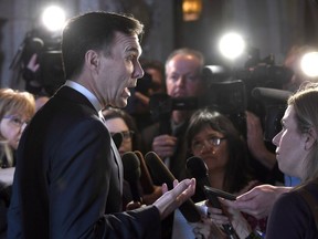 Minister of Finance Bill Morneau speaks to reporters after leaving a cabinet meeting on Parliament Hill in Ottawa on February 6, 2018. One of the predominant themes of next week's federal budget will be increasing the work-force participation of women -- and recently released internal documents point to big economic benefits for Canada if it can help more women enter the job market.The Liberal government has said improving the economic success of women and promoting gender equality will be primary objectives of next Tuesday's budget.