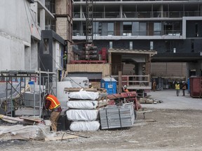 Work on a housing development in Toronto's Lawrence Heights neighbourhood is shown on November 22, 2017. Ontario shed 59,300 part-time jobs in January as the province implemented a $2.40 cent minimum wage hike at the start of the month. Statistics Canada says the province shed 50,800 jobs total from December 2017, gaining 8,500 full-time positions but losing 59,300 part-time ones.
