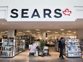 Shoppers enter and leave a Sears retail store in Toronto on Thursday, October 19, 2017. Former Sears Canada workers are hoping they can recoup a $270-million pension fund shortfall with a motion they will file in court.