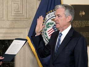 Jerome Powell takes the oath of office as the new chairman of the Federal Reserve, Monday, Feb. 5, 2018, in Washington.
