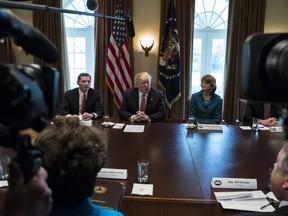 President Donald Trump, joined by Sen. John Barrasso, R-Wyo., left, and Sen. Lisa Murkowski, R-Alaska, right, speaks to media during a meeting with bipartisan members of congress about infrastructure in the Cabinet Room of the White House in Washington, Wednesday, Feb. 14, 2018.