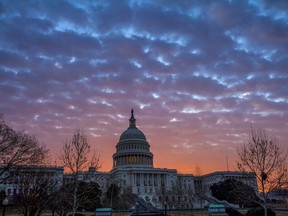 Dawn breaks over the Capitol in Washington, Tuesday, Feb. 6, 2018, as House GOP leaders are proposing to keep the government open for another six weeks by adding a year's worth of Pentagon funding to a stopgap spending bill. But Senate Democratic leader Chuck Schumer says that approach, fully funding the Defense Department but only providing temporary money for the rest of the government, won't go anywhere.
