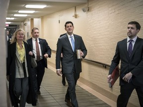 House Speaker Paul Ryan, R-Wis., center, walks to a Republican strategy conference at the Capitol as House GOP leaders are proposing to keep the government open for another six weeks by adding a year's worth of Pentagon funding to a stopgap spending bill, in Washington, Tuesday, Feb. 6, 2018.