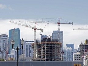 This Monday, July 17, 2017, photo, shows a partial view of construction underway in downtown Miami. On Thursday, Feb. 1, 2018, the Commerce Department reports on U.S. construction spending in December.