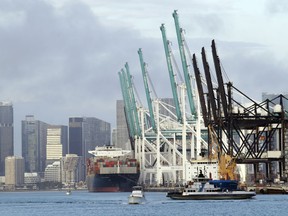 A container ship is docked at the Port of Miami, Monday, Feb. 5, 2018, in Miami Beach, Fla. The Commerce Department reports on the U.S. trade gap for December, on Tuesday, Feb. 6.