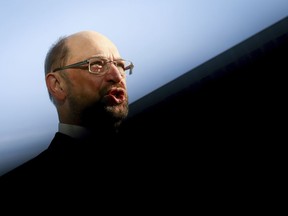 Social Democratic party chairman Martin Schulz gives a brief statement when arriving for what is supposed to be the last day of the coalition talks between Angela Merkel's Christian Democratic bloc and the Social Democratic party at the CDU headquarters in Berlin Tuesday, Feb. 6, 2018. (Kay Nietfeld/dpa via AP