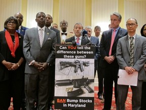 FILE - In this Feb. 1, 2018 file photo, Sen. Robert Zirkin, a Democrat, talks about measures aimed at protecting Maryland residents from gun violence during a news conference with Democrats in Annapolis, Md. Del. David Moon, far right, is sponsoring a bill to ban bump stocks, devices that enable rapid-fire shooting similar to fully automatic weapons. Some states and cities are taking the lead on banning bump stocks as efforts stall in Washington. The controversial device was used in the Las Vegas shooting, allowing a semi-automatic rifle to mimic a fully automatic firearm. Gun-control advocates say the push fits a pattern in gun politics: inaction in Washington that forces states to take charge.