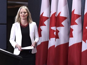 Minister of Environment and Climate Change Catherine McKenna arrives for a press conference on the government's environmental and regulatory reviews related to major projects, in the National Press Theatre in Ottawa on Thursday, Feb. 8, 2018.