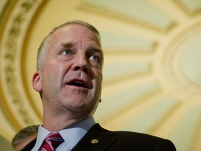 FILE - U.S. Sen. Dan Sullivan, R-Alaska, speaks during a news conference on Capitol Hill in Washington, Tuesday, July 12, 2016. A policy intended to protect against the illegal trade of ivory has prompted a creative works online sales website to cancel accounts held by Alaska Native artists, who can legally use ivory in their artwork. Sullivan asked the chief executive officer of Etsy to reconsider its policy to allow Alaska Natives to continue to sell products made from walrus tusks or from petrified wooly mammoth remains found in the nation's most remote state.