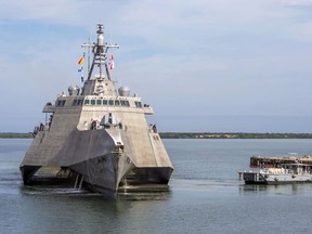 In this Jan. 3, 2018, photo released by the U.S. Navy, a Naval Station vessel, right, prepares to assist the future USS Omaha (LCS 12), a 218-foot-long littoral combat ship, pier side during a brief fuel stop in Guantanamo Bay, Cuba. The Omaha was conducting a change of homeport to San Diego, Calif.