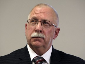 FILE - This Aug. 19, 2010 file photo shows Arizona Department of Corrections Director Charles Ryan at a news conference in Phoenix. A judge overseeing a class-action lawsuit over the quality of health care in Arizona's prisons will hold a hearing this week to determine whether to fine the state for falling short in improving care for inmates. U.S. Magistrate David Duncan has threatened to hold Ryan and another prison official in civil contempt of court and fine the state $1,000 for each instance of noncompliance in December and January.