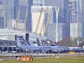 Planes on the apron at London City Airport which has been closed after the discovery of an unexploded Second World War bomb was found in the nearby River Thames, Monday Feb. 12, 2018.