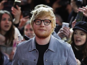 Singer-songwriter Ed Sheeran, center, arrives for the screening of the film 'Songwriter' during the 68th edition of the International Film Festival Berlin, Berlinale, in Berlin, Germany, Friday, Feb. 23, 2018.
