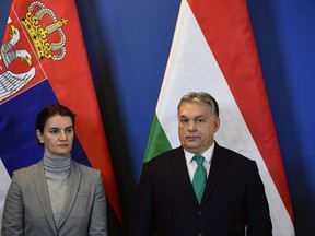 Hungarian Prime Minister Viktor Orban, right, and Prime Minister of Serbia Ana Brnabic participate in a signing ceremony following a bilateral governmental summit of Hungary and Serbia in Budapest, Hungary, Friday, Feb. 9, 2018.