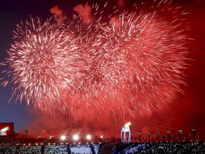 Fireworks detonate after the Olympic flame was lit during the opening ceremony of the 2018 Winter Olympics in Pyeongchang, South Korea, Friday, Feb. 9, 2018.