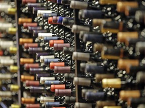 FILE - In this June 16, 2016, file photo, bottles of wine are displayed during a tour of a state liquor store, in Salt Lake City. Higher liquor prices and other changes under a broad new Utah liquor law will take effect Saturday, July 1, 2017, along with a highway funding bill and a test program allowing people convicted of drunken driving to avoid having their driver's license suspended. (AP Photo/Rick Bowmer, File) ORG XMIT: UTRB102