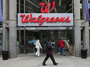 FILE - This June 4, 2014, file photo, shows a Walgreens retail store in Boston. Shares of AmerisourceBergen are soaring before the opening bell, Tuesday, Feb. 13, 2018,  on reports that Walgreens is pursuing a complete takeover of the huge drug distributor. The Wall Street Journal is reporting that Walgreens CEO Stefano Pessina reached out to AmerisourceBergen Corp. with the potential deal. Walgreens already owns about 26 percent of the company.