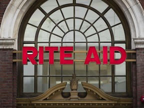 FILE - This Oct. 21, 2016 file photo shows a Rite Aid location in Philadelphia. The privately held owner of Safeway, Vons and other grocery brands is plunging deeper into the pharmacy business with a deal to buy Rite Aid, the nation's third-largest drugstore chain. Albertsons Companies is offering either a share of its stock and $1.83 in cash or slightly more than a share for every 10 shares of Rite Aid. A deal value was not disclosed in a statement released Tuesday, Feb. 20, 2018,  by the companies.