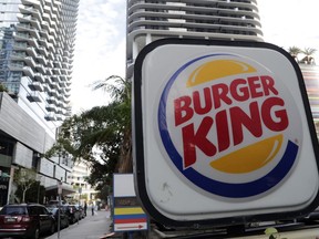 This Tuesday, Jan. 30, 2018, photo shows a sign for a Burger King in Miami. Restaurant Brands International, the parent company of Burger King and Tim Hortons, reports financial results Monday, Feb. 12, 2018.