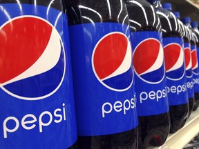 FILE - In this July 9, 2015, file photo, Pepsi bottles are on display at a supermarket in Haverhill, Mass. PepsiCo reports financial results Tuesday, Feb. 13, 2018.