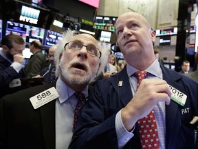 FILE- In this Thursday, Feb. 8, 2018, file photo, traders Peter Tuchman, left, and Patrick Casey work on the floor of the New York Stock Exchange. The stock market has found firmer footing following its breathtaking drop earlier this month, where the S&P 500 lost 10 percent in just nine days.