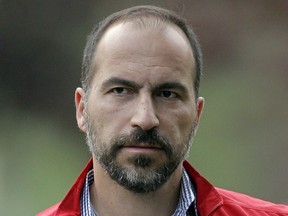 FILE - In this July 13, 2012, file photo, Expedia CEO Dara Khosrowshahi attends the Allen & Company Sun Valley Conference in Sun Valley, Idaho. Ride-hailing giant Uber's full-year net loss widened to $4.5 billion in 2017. The results also showed that Uber cut its fourth-quarter net loss by 25 percent from the third quarter as new CEO Khosrowshahi moves to make the company profitable ahead of a planned initial public stock offering sometime next year.