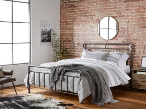 This undated artist rending provided by Walmart shows their industrial bedroom, which is part of Walmart's new online home shopping experience that will let shoppers discover items based on their style. The move, announced Thursday, Feb. 22, 2018, is the first glimpse of Walmart's broader efforts to redesign its site with a focus on fashion and home furnishing. (Walmart via AP)