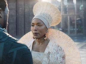 This image released by Disney -Marvel Studios shows Chadwick Boseman, left, and Angela Bassett in a scene from "Black Panther." Actress Danai Gurira says the representation of women in the film is important for young girls to see. The film features a number of powerful female leads, including Gurira as the head of a special forces unit, Lupita Nyong'o as a spy, Bassett as the Queen Mother and newcomer Letitia Wright as a scientist and inventor.  (Disney/Marvel Studios via AP)