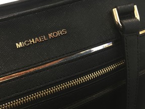 FILE - This Feb. 7, 2017, file photo shows a Michael Kors purse in New York. Michael Kors reports earnings Wednesday, Feb. 7, 2018. (AP Photo, File)