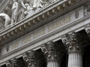 FILE - This Oct. 2, 2014, file photo shows the facade of the New York Stock Exchange. The U.S. stock market opens at 9:30 a.m. EST on Thursday, Feb. 8 2018.