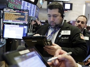 Trader Michael Capolino works on the floor of the New York Stock Exchange, Wednesday, Feb. 7, 2018. Stocks are opening modestly higher on Wall Street as the market stabilizes following three days of tumult.