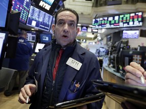 Trader Tommy Kalikas works on the floor of the New York Stock Exchange, Wednesday, Feb. 7, 2018. Stocks are opening modestly higher on Wall Street as the market stabilizes following three days of tumult.