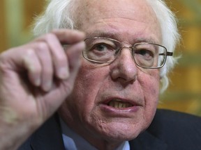 FILE - In this Tuesday, Feb. 13, 2018, file photo, Senate Banking Committee ranking member Sen. Bernie Sanders, I-Vt., asks a question while testifying before the Senate Budget Committee regarding President Donald Trump's fiscal year 2019 budget proposal, in Washington. A number of high-profile liberals are calling for repeal of the Republican tax plan that President Donald Trump signed into law. But not all of them back full repeal, including Sanders.