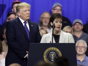 Deana Spoleti speaks as President Donald Trump listens during a speech on tax policy during a visit to Sheffer Corporation, Monday, Feb. 5, 2018, in Blue Ash, Ohio.