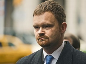 FILE - In this Dec. 20, 2017, file photo, Brandon Bostian, the Amtrak engineer involved in a 2015 derailment in Philadelphia that killed eight people and injured more than 200, departs after a hearing at the Criminal Justice Center in Philadelphia. During a Tuesday, Feb. 6, 2018, hearing, prosecutors were set to argue that charges should be reinstated against Bostian, after involuntary manslaughter charges were thrown out Sept. 12, 2017, by a judge who determined the evidence pointed to an accident.