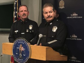 Los Angeles Police Capt. Stephen Carmona, right, speaks at a news conference about cannabis enforcement in Los Angeles Wednesday, Feb. 14, 2018. At left, Los Angeles Police Deputy Chief John Sherman. Los Angeles has issued licenses to nearly 100 cannabis retailers but police estimate there are at least two-to-three times that number operating illegally in the city. Capt. Carmona says Wednesday that police have shut down eight illegal marijuana shops since Jan. 1, 2018.