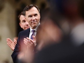 Finance Minister Bill Morneau gets an ovation after delivering the federal budget in the House of Commons in Ottawa on Tuesday, Feb.27, 2018.