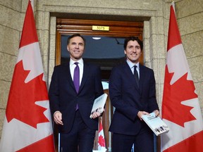 Finance Minister Bill Morneau and Prime Minister Justin Trudeau leave the prime minister's office to table the federal budget in the House of Commons in Ottawa on Tuesday, Feb.27, 2018.