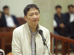 FILE - In this  Jan. 24, 2018, file photo, Trinh Xuan Thanh, a former chairman of state energy giant PetroVietnam's construction arm, appears in court in Hanoi, Vietnam. The court handed a life prison term to Thanh at Vietnam's state oil giant who Germany said was kidnapped from there by Vietnamese agents last year. State-run VnExpress said Thanh, was convicted of embezzling $622,000 from a property project at the end of the two-week trial Monday, Feb. 5, 2018.