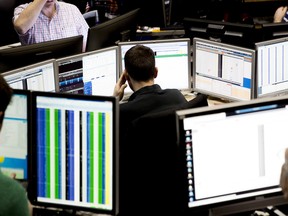 A trader looks over computer monitors in the Cboe Volatility Index (VIX) pit in Chicago