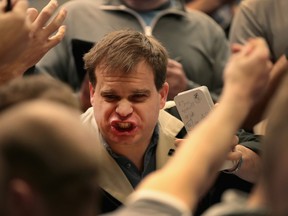 Traders signal offers in the S&P options pit at the Cboe Global Markets exchange on February 6, 2018 in Chicago