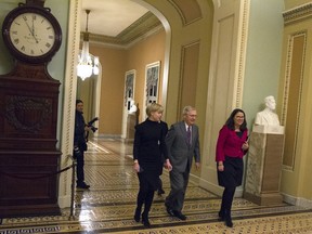 In this Feb. 8, 2018, photo, Senate Majority Leader Mitch McConnell of Ky., walks to the Senate chamber early shortly before midnight Thursday, Feb. 8, 2018, at the U.S. Capitol in Washington. The weeklong drama over the hourslong government shutdown set loose overblown rhetoric from both parties while President Donald Trump wrestled inartfully with turmoil in the stock market, one of his favorite bragging points until it tanked.